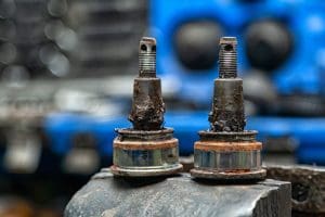 Close-up of heavily worn front ball joint in 4x4 repair shop - boulder colorado